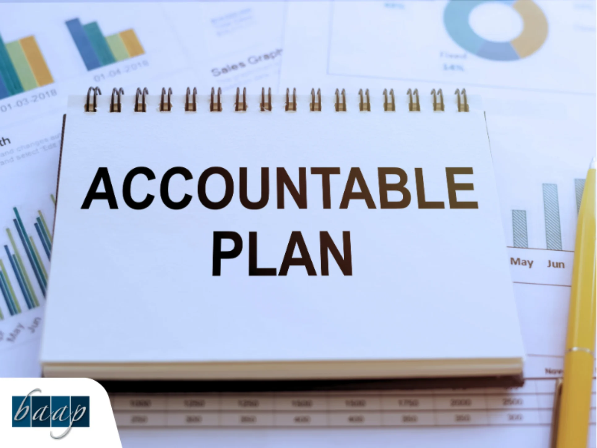 Accountable plan text on a notepad surrounded by business graphs and reports