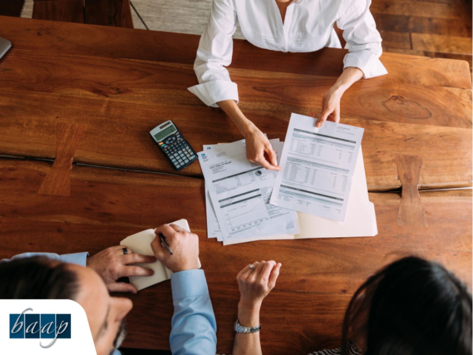 Business advisor reviewing financial documents with a small business owner