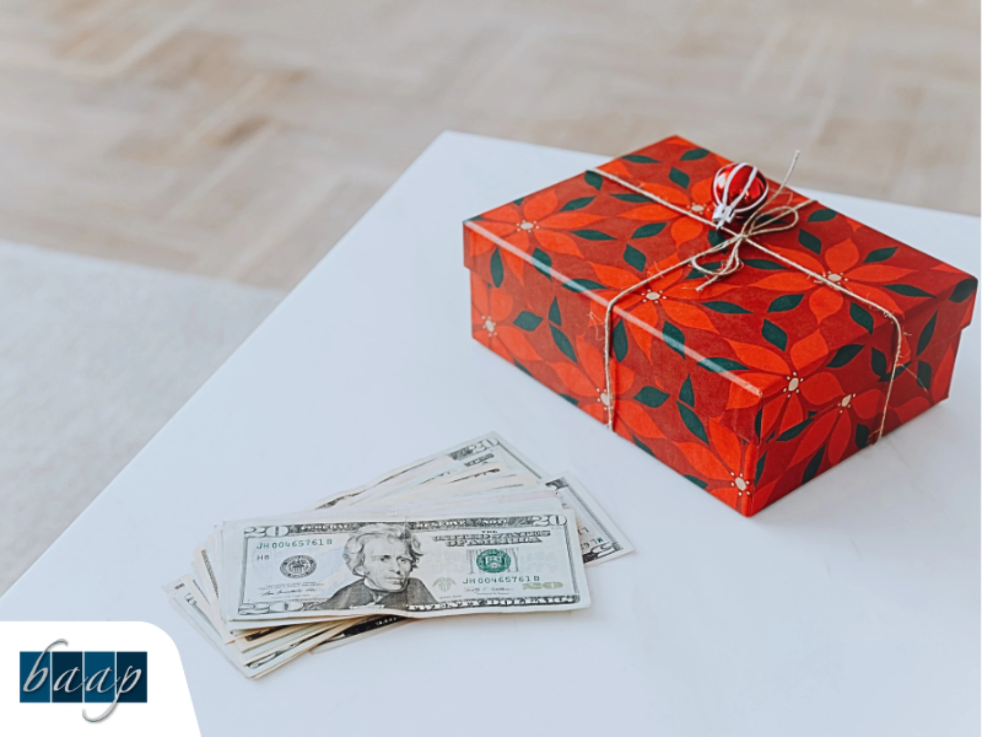 Red gift box with cash on a table symbolizing tax-efficient gifting strategies